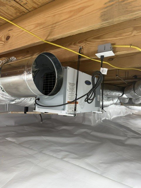HVAC air handler and insulated ductwork installed in crawlspace with vapor barrier
