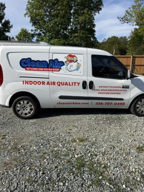 White Clean Air service van with blue logo and red text listing air duct cleaning and indoor air quality services