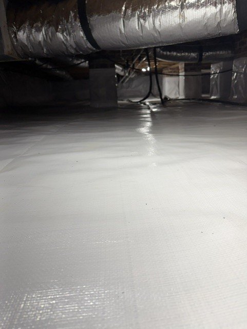 White vapor barrier encapsulation in crawlspace with HVAC ductwork